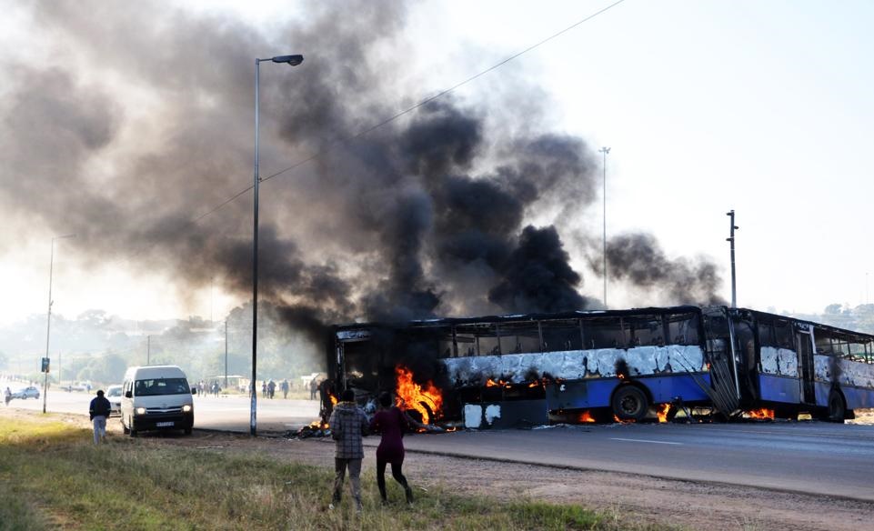 Angry residents burned buses to prevent members of the Red Ants entering their squatter camp yesterday. Photo by Raymond Morare