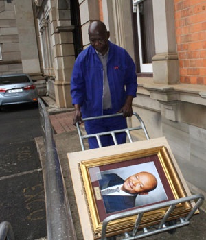 Portraits of former Premier Senzo Mchunu being removed from the KwaZulu-Natal Provincial Legislature. Picture: Siyanda Mayeza/City Press