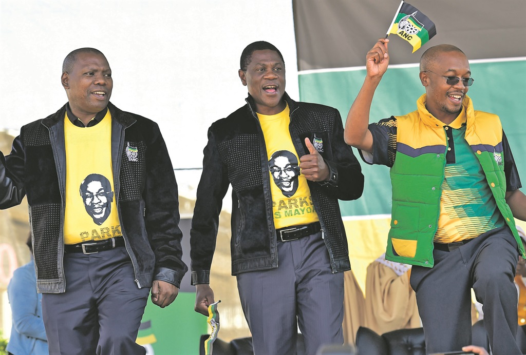 From left: ANC treasurer-general Zweli Mkhize, Gauteng ANC chairman Paul Mashatile and Joburg mayor Parks Tau celebrate the adoption of the Freedom Charter .     Photo by Noko Mashilo 