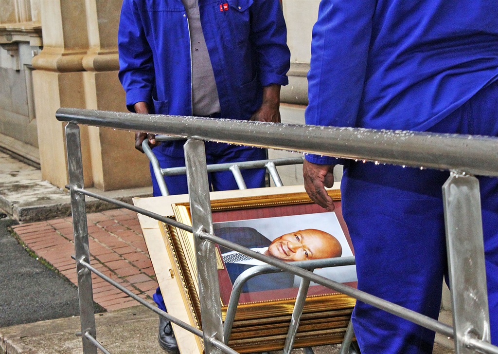 A portrait of Senzo Mchunu is removed from the provincial legislature this week PHOTO: siyanda mayeza 