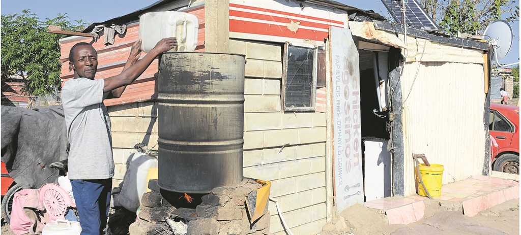 Johannes Ramodike built his own geyser from an old barrel and a fireplace.               Photos by            Joshua Sebola 