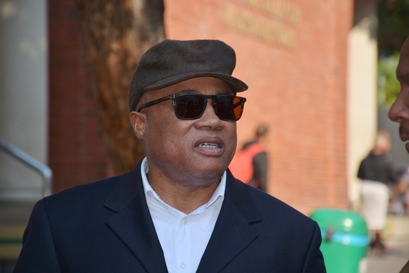 Tony Yengeni walks outside the Cape Town Magistrate court on Tuesday Cape Town.  Photo by Lulekwa Mbadamane 