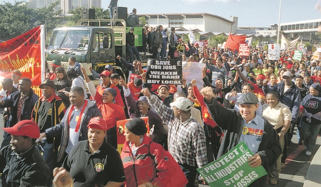 Workers march in Cape Town in June 2005 to protest against the flood of cheap Chinese clothing imports, which were bringing the Cape textile industry to its knees. The industry has stabilised over the years and is looking to claw back its losses. Picture: Steve Kretzmann 