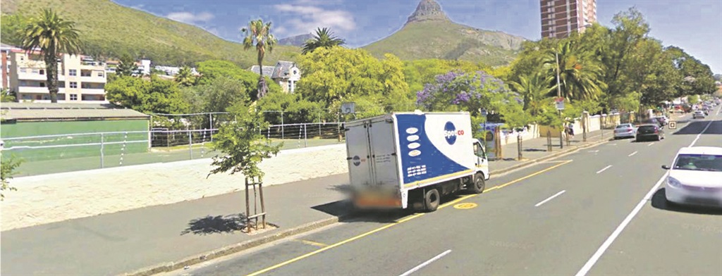 Members of the Reclaim the City Campaign took to the street this week to protest the proposed sale of the Tafelberg Remedial School (on left side of the road) in Sea Point, Cape Town, to a private developer  