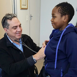Ten-year-old Philasande Dladla from KwaZulu-Natal is examined by cardiac and transplant surgeon, Dr Willie Koen, before his discharge from Netcare Christiaan Barnard Memorial Hospital in Cape Town.