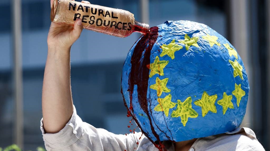 An activist from the climate change protest group Extinction Rebellion (XR) takes part in a protest to draw attention on missing UK journalist Dom Phillips and Brazilian Indigenous affairs specialist Bruno Pereira near the European Commission building in Brussels. (Kenzo Tribouillard/AFP)