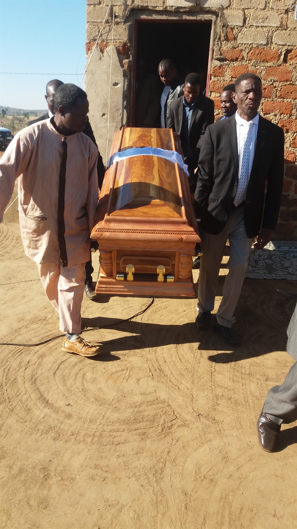 Pallbearers carrying coffin of Rithandzu Manganyi 