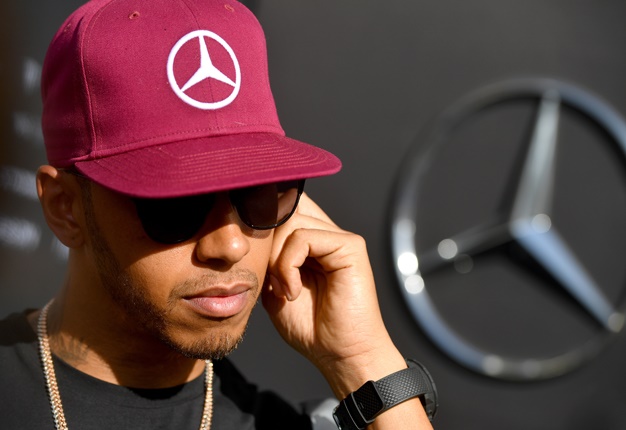 <b>F1 DRIVER + GUNS:</b> Lewis Hamilton will be make a cameo appearance in the next Call of Duty game. <i>Image: AFP / Andrej Isakovic</i>