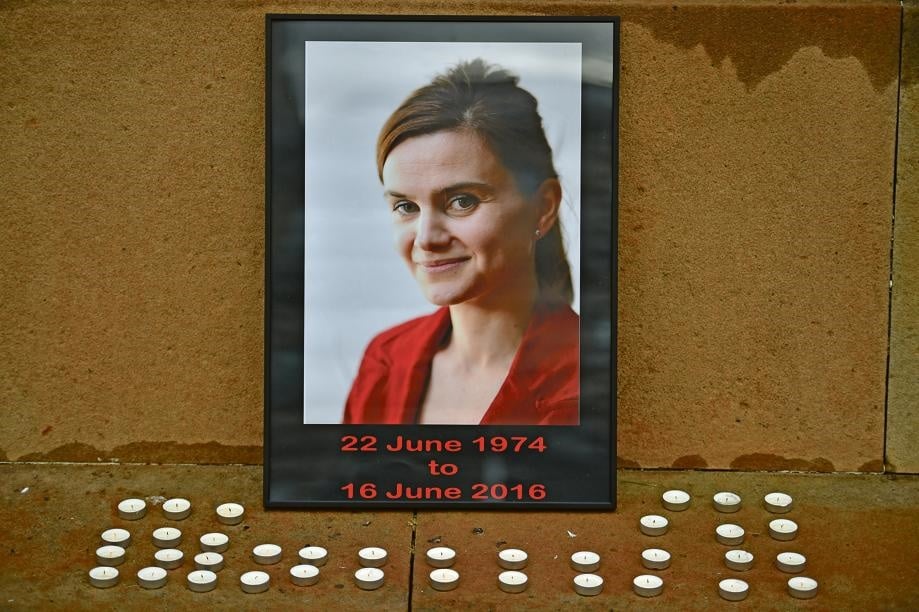 CASUALTY IN THE BREXIT WAR? Candles surround a photo of slain Labour MP Jo Cox before a vigil in her memory in George Square on Friday. She was shot and stabbed in the street on Thursday. A 52-year-old man, Thomas Mair, was charged with her murder. Picture: Getty images