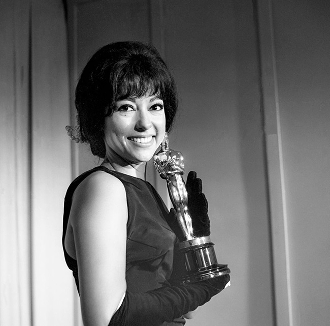 Rita Moreno poses with her Oscar after she was named Best Supporting Actress for her role in West Side Story.(Photo by Bettmann Archive/Getty Images)
