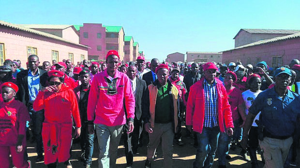 EFF leader Julius Malema leads members of his party during a visit to Sethokga Hostel in Tembisa yesterday.                                                  Photo by NEWS24 