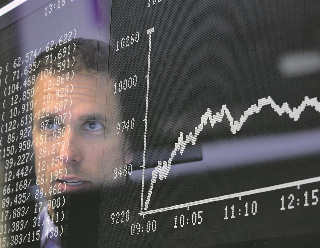 trepidation A trader sits at his desk watching the day’s performance board, showing a dive in the value of the DAX index of companies at the Frankfurt Stock Exchange the day after a majority of the British public voted to leave the European Union  PHOTO: getty images 