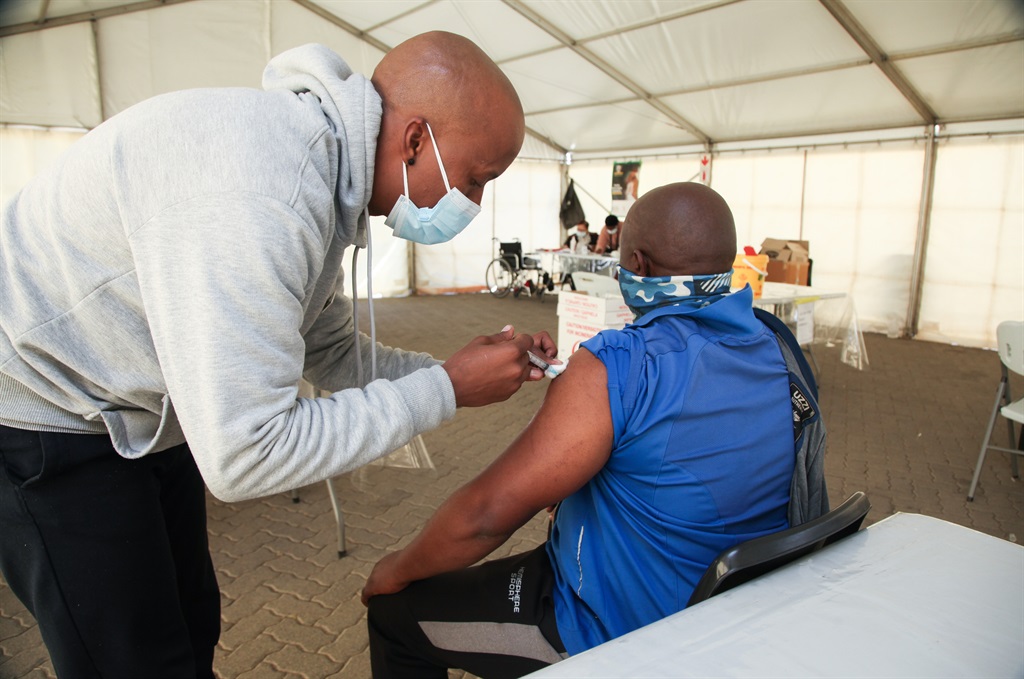 Citizens receiving the Covid-19 vaccine at Zandspruit vaccination site earlier this month. (Photo by Gallo Images/Luba Lesolle)