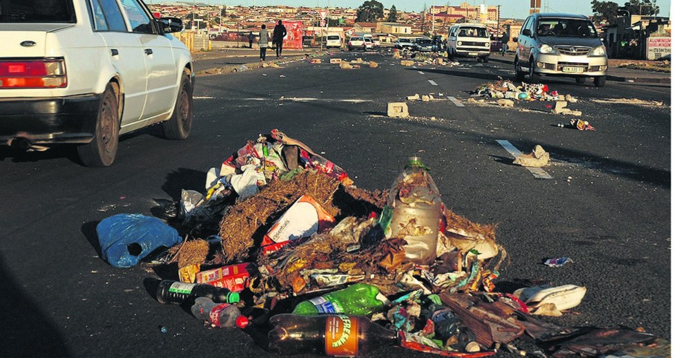 Cars troubled by rubbish at Daku Road in KwaZakhele kasi in Port Elizabeth during ANC candidate list.  Photo by Chris Qwazi 