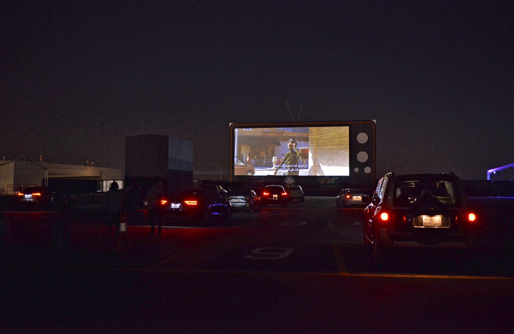 Vehicles take their place in the first drive-in cinema in the Saudi capital Riyadh. (FAYEZ NURELDINE / AFP)