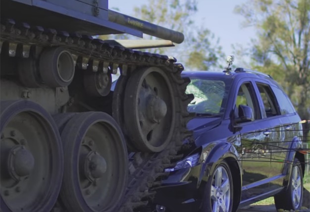 <b>MAD BEYOND REASON:</B> After growing increasingly frustrated with his Dodge Journey's unreliability and lack of safety, this Australian family got a tank to get rid of their family car. <i>Image: YouTube</I>