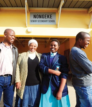 From left: Principal Velile Tikisa, secretary of the school governing body Nonfundiso Gumbi, Grade 12 pupil Oyama Cele and former pupil Nkululeko Zulu – now studying medicine – are proud of the school in their area, though it still needs a lot of work. Picture: Leon Sadiki