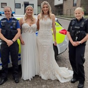 'To the rescue': UK brides get 'a lift in style' from police after their coach breaks down