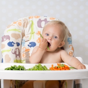 Baby eating vegan food – iStock