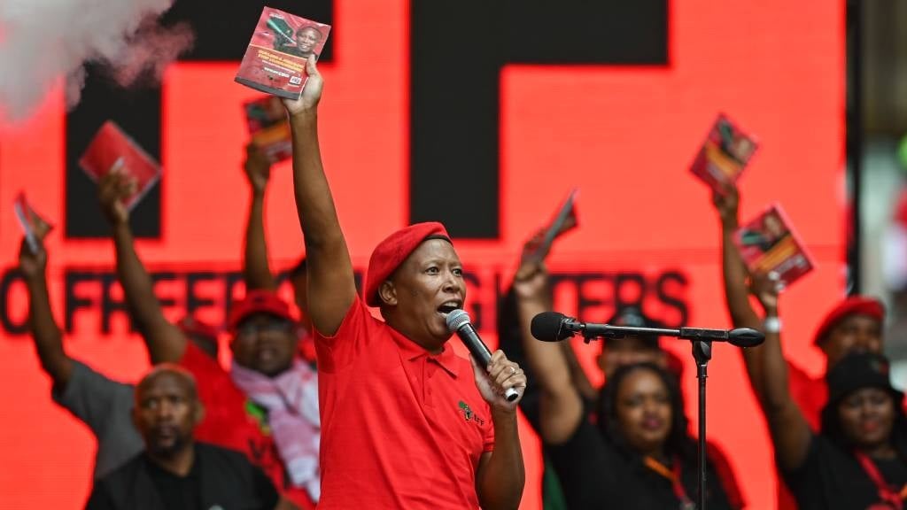 EFF president Julius Malema stands with the manifesto book at the Economic Freedom Fighters (EFF) Election Manifesto Launch at Moses Mabhida Stadium in Durban. The manifesto launch provided a platform for the EFF to outline its plans for the 2024 national and provincial polls. 