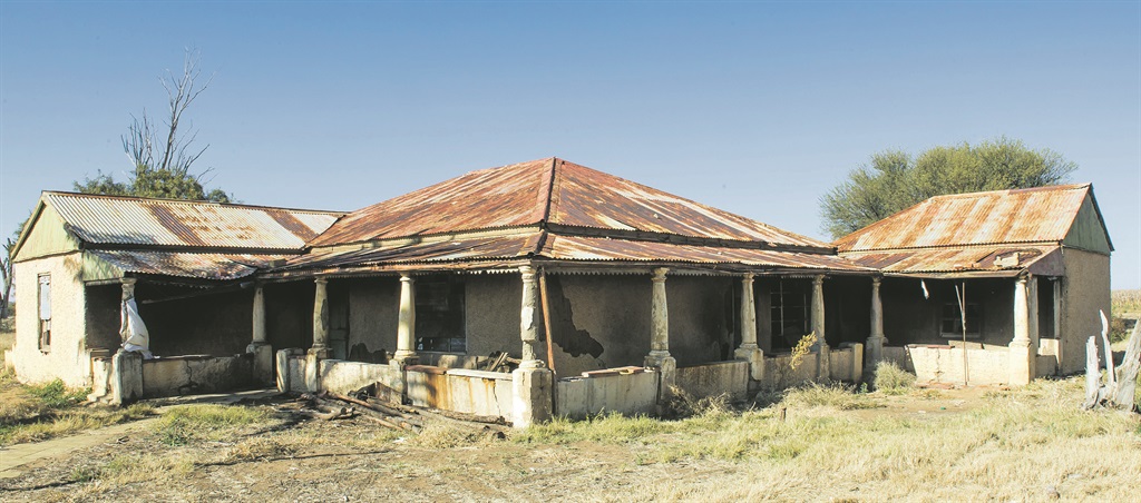 Dilapidated farm buildings, such as this one near Welkom, are being occupied by people who provide food and infrastructure for illegal miner workers, who sometimes live underground for months. Picture: Deon Raath 
