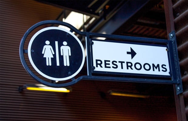 Sign pointing to bathrooms