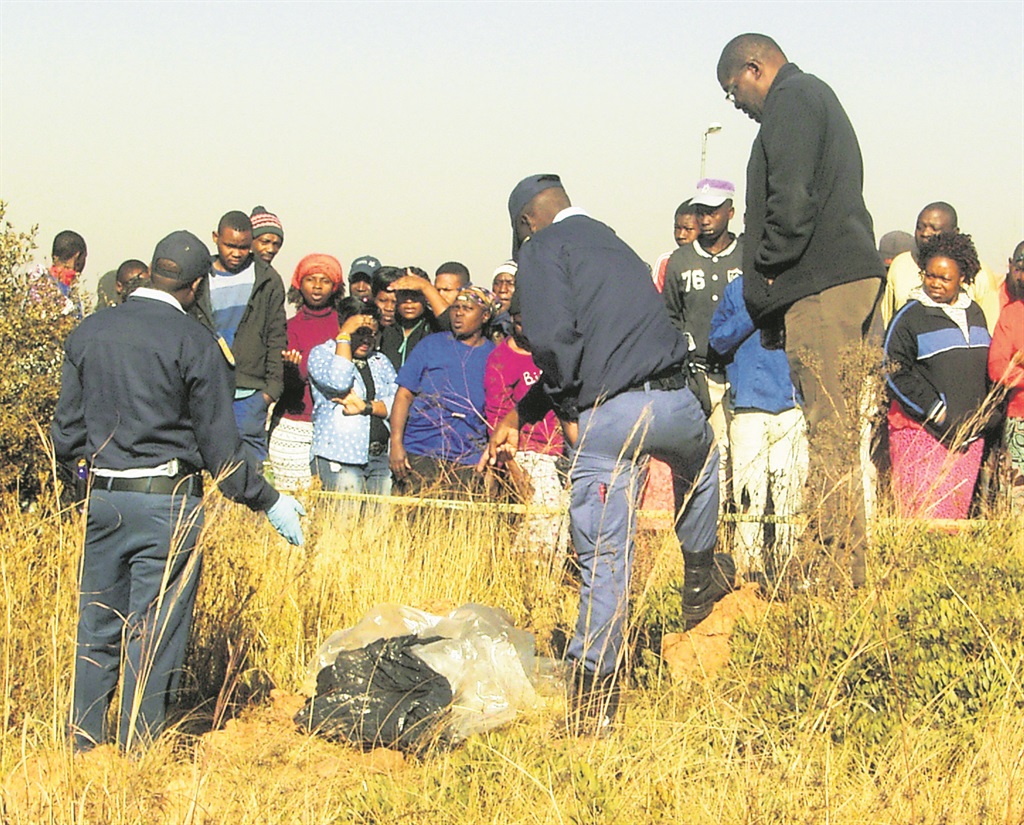 The body of a man without some body parts was found at a field in Chiawelo, Soweto over the weekend.                       Photo by Stephens Molobi  