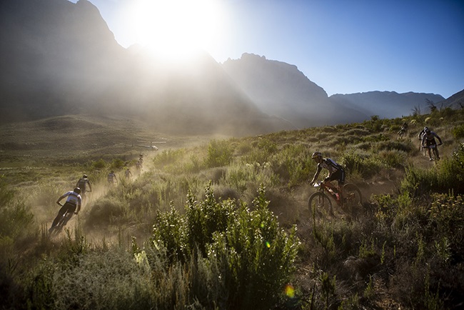 The lead bunch during the final stage (stage 7) of the 2019 Absa Cape Epic Mountain Bike stage race from the University of Stellenbosch Sports Fields in Stellenbosch to Val de Vie Estate in Paarl on the 24 March 2019. (Photo: Supplied/Absa Cape Epic)