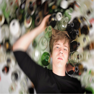 Boy surrounded by alcohol