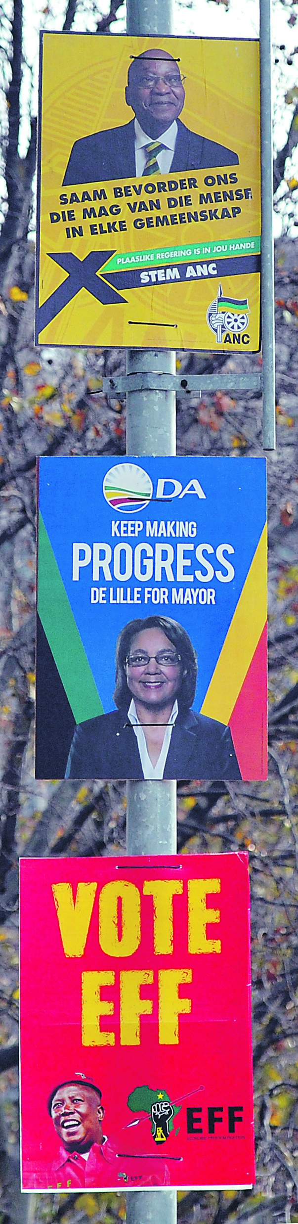 Political posters seen on street lamp. Picture: Lulama Zenzile   