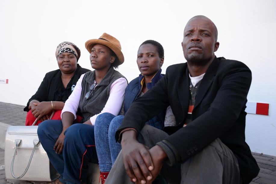 Johannes Tshokwe the husband and his wife’s sisters Anna Matlou, Puseletso Marakalala and Ruth Moropeng says they are all disappointed that while they together with the police where convinced that their sister was missing together with her three kids, she was enjoying herself with her lover. Photo by Joshua Sebola