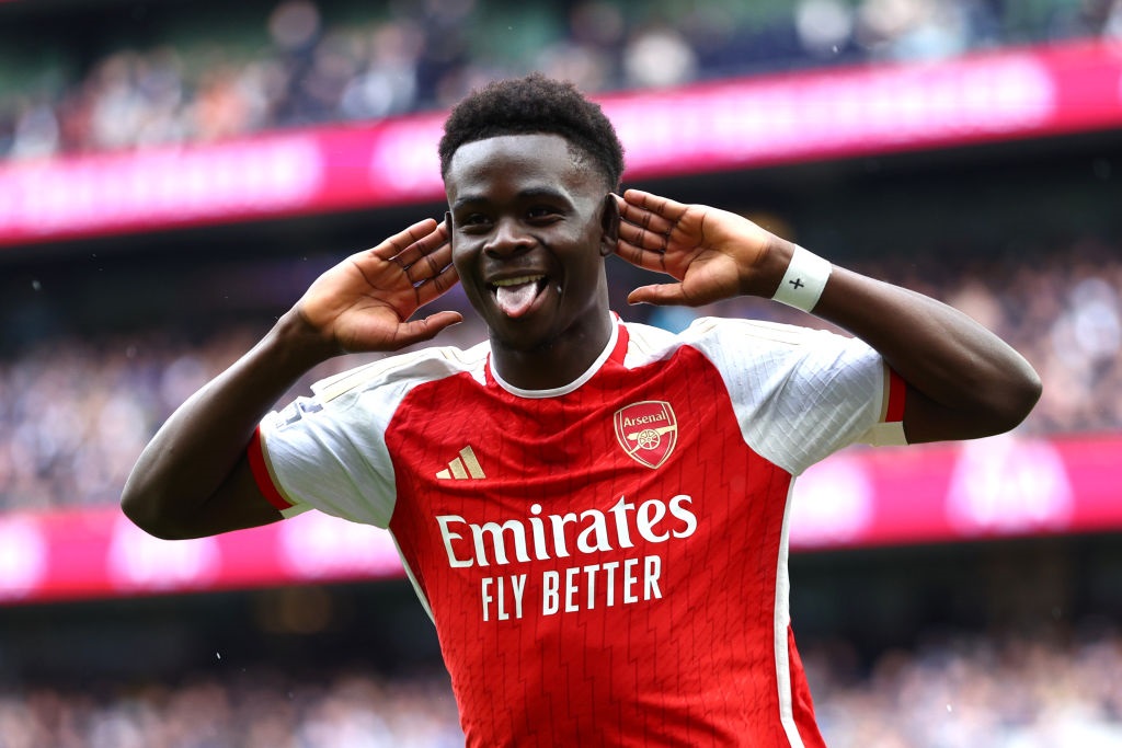 LONDON, ENGLAND - APRIL 28: Bukayo Saka of Arsenal celebrates scoring his teams second goal during the Premier League match between Tottenham Hotspur and Arsenal FC at Tottenham Hotspur Stadium on April 28, 2024 in London, England. (Photo by Clive Rose/Getty Images)