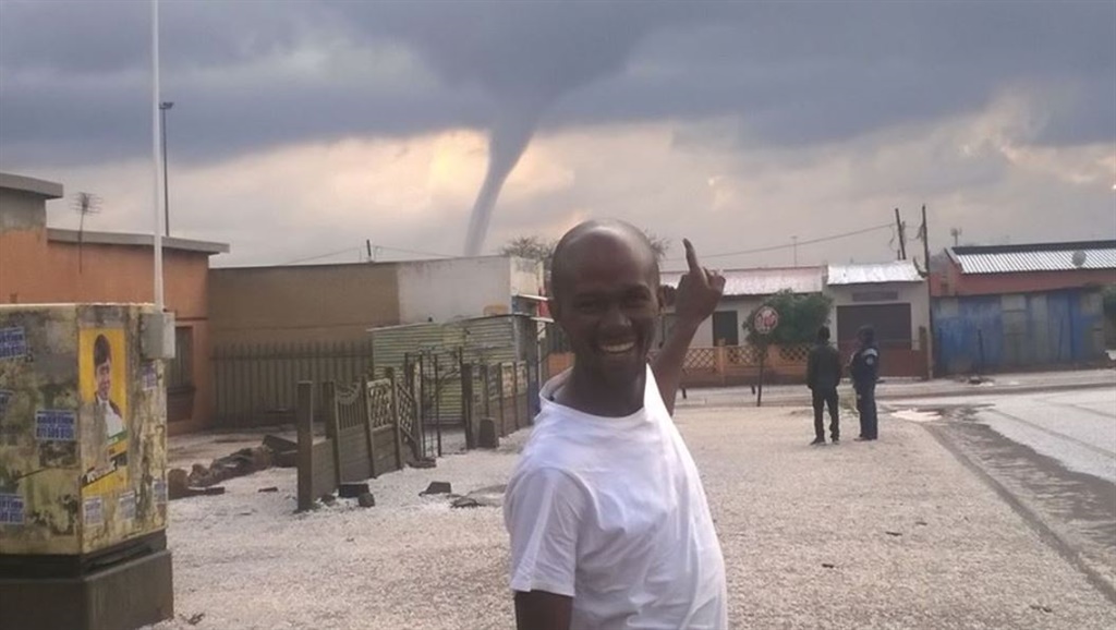 A resident looks happily unconcerned just before the tornado lashed Ekurhuleni. Photo by Neal Collins/Twitter