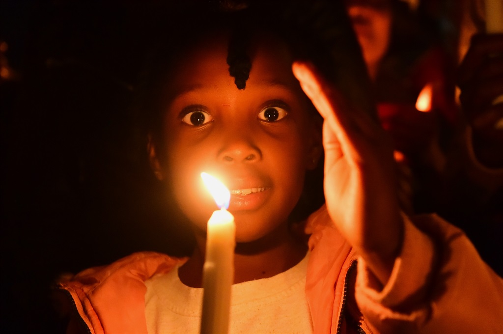 Community members of Soweto held a candlelight cer