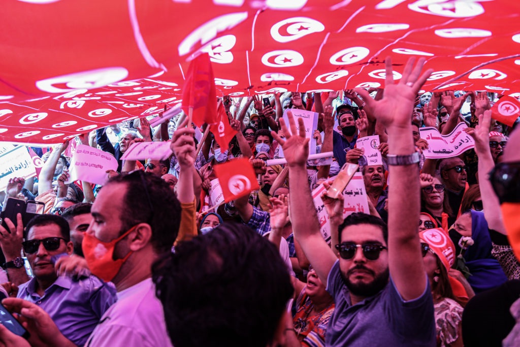 People take part in a protest supporting Tunisian President Kais Saied. (Photo by Khaled Nasraoui/picture alliance via Getty Images)