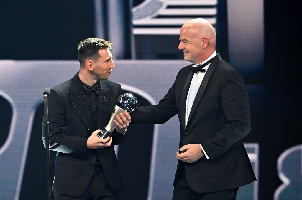 Lionel Messi is congratulated by Fifa president Gianni Infantino after being presented with the Best Fifa men's player award during the awards ceremony in Paris, France. 