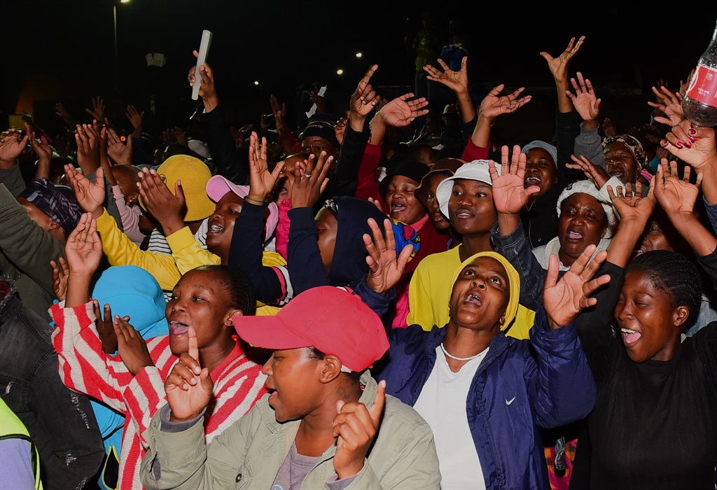 Community members of Soweto held a candlelight cer