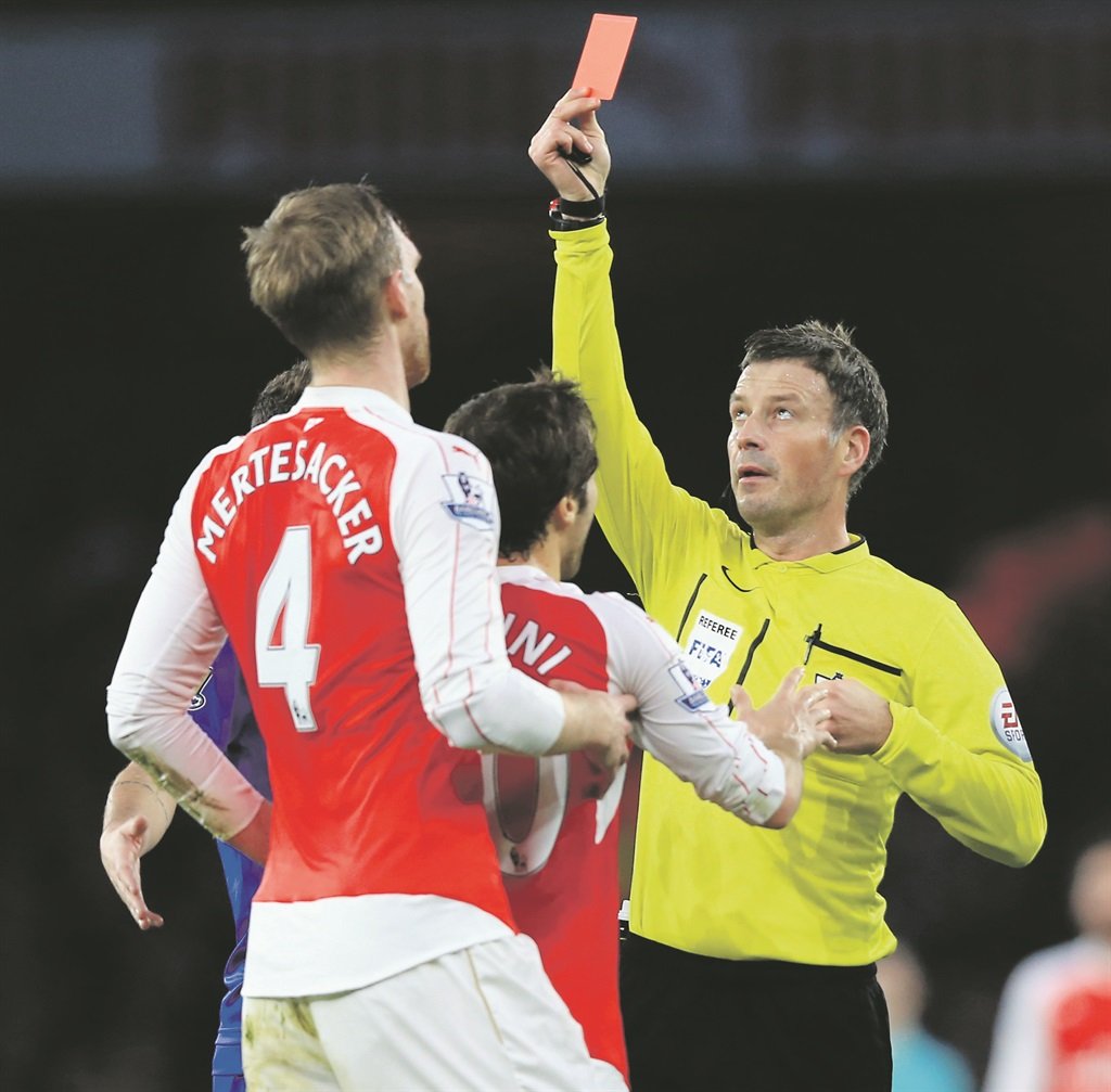 SEEING RED No-nonsense English referee Mark Clattenburg shows Arsenal defender Per Mertesacker a red card last season. It will be interesting to see how the strict whistle-man will apply the stringent new rules. Picture: Adam Davy 