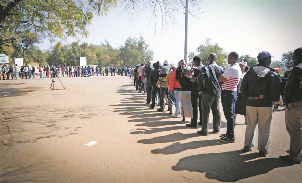 TURNING THE TIDE Voters from Marikana, on the outskirts of Rustenburg, queue to vote in last week’s local government elections.  Picture: Thapelo Maphakela 