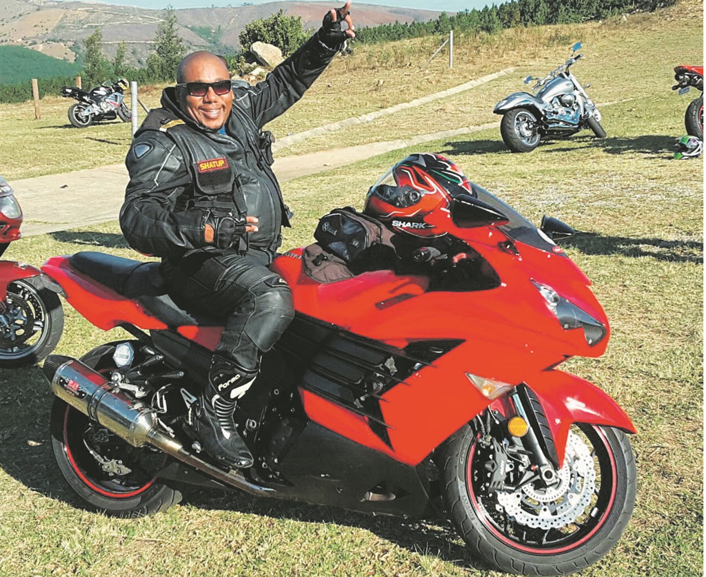 Stanley Tshikovhele from Limpopo shows his passion for his red bike.                 Photo by Eugene Malaka 
