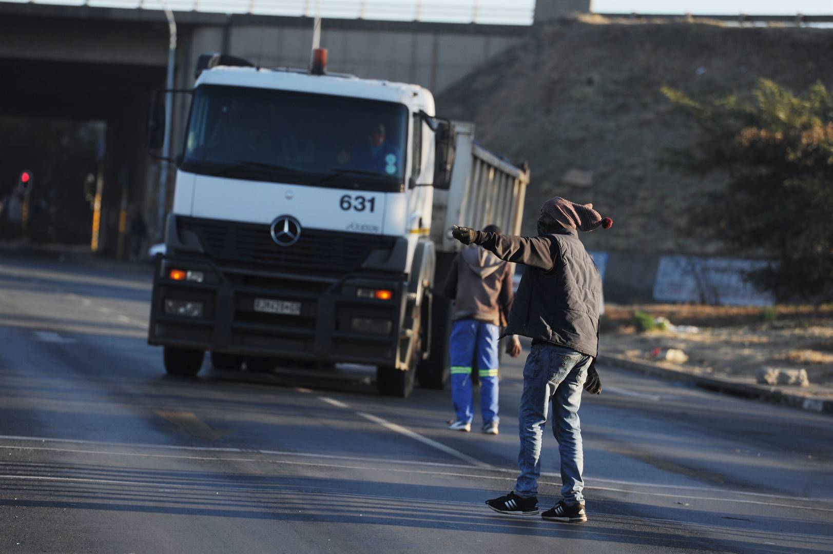 Truck drivers slam a truck in an attempt to force drivers to park at City Deep Truck stop in Doornfontein, Johannesburg. South African truck drivers are protesting against the employment of foreign nationals. Picture: Rosetta Msimango/City Press