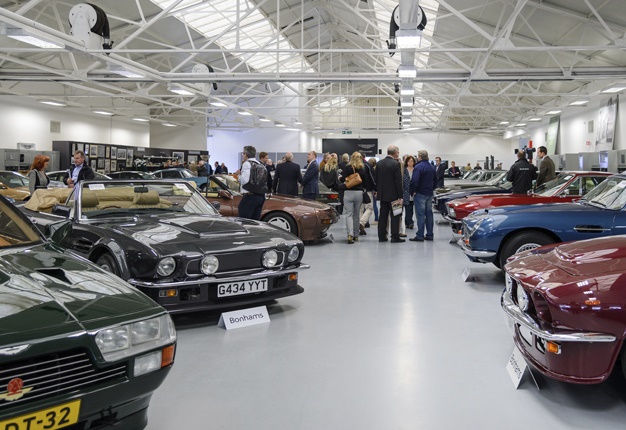 <b> AUTOMOTIVE NIRVANA: </b> Admirers of  the Aston Martin and Lagonda marques at the Bonhams auction. <i> Image: Newspress </i>