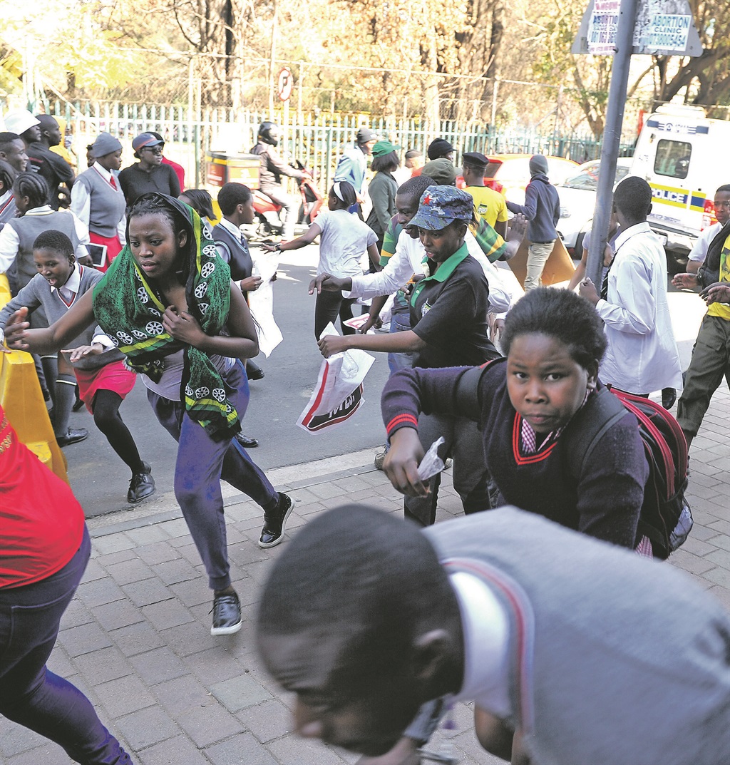 ON THE RUN Students in Doornfontein protesting against fee increases flee police  Picture: Felix Dlangamandla 