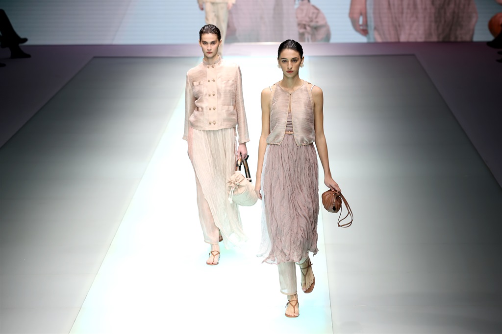 MILAN, ITALY - SEPTEMBER 23: Models walk the runwa