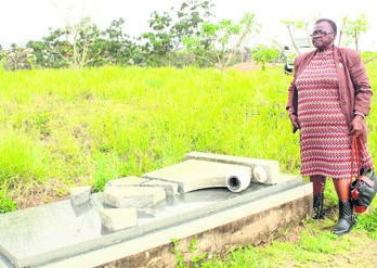 Zibambeleni Zuma found her son’s tombstone broken.           Photo by Mavi Ngcobo