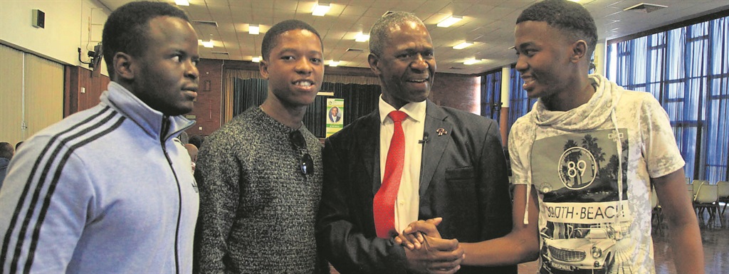 From left: Students Melusi Biyela, Thembani Cele and Sabelo Duma enjoy a chat with health MEC Dr Sibongiseni Dhlomo (in the red tie) at Addington Hospital on Tuesday.  Photo by the Department of Health   
