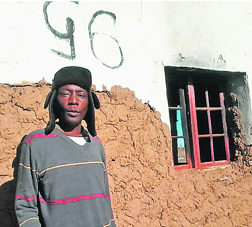 Thuthuzela Zoko is terrified by the G6 sign on his wall.   Photo by Unathi Mshumpela 