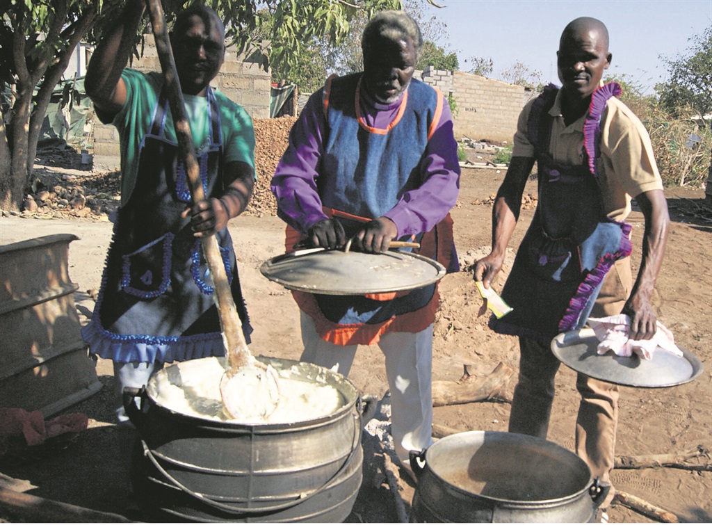 These men can cook . . . and their wives love it.  Photo by Elizabeth Langa 