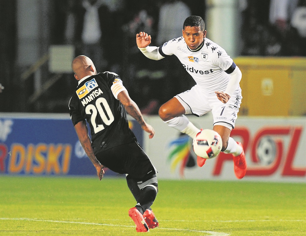 Daine Klate of Bidvest Wits in action with Oupa Manyisa of Orlando Pirates during last night’s MTN8 quarterfinal match at the Bidvest Stadium. Picture: Gallo Images 