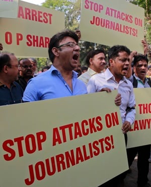 Indian journalists hold placards during a protest against attack on journalists in Mumbai. (File,AP).